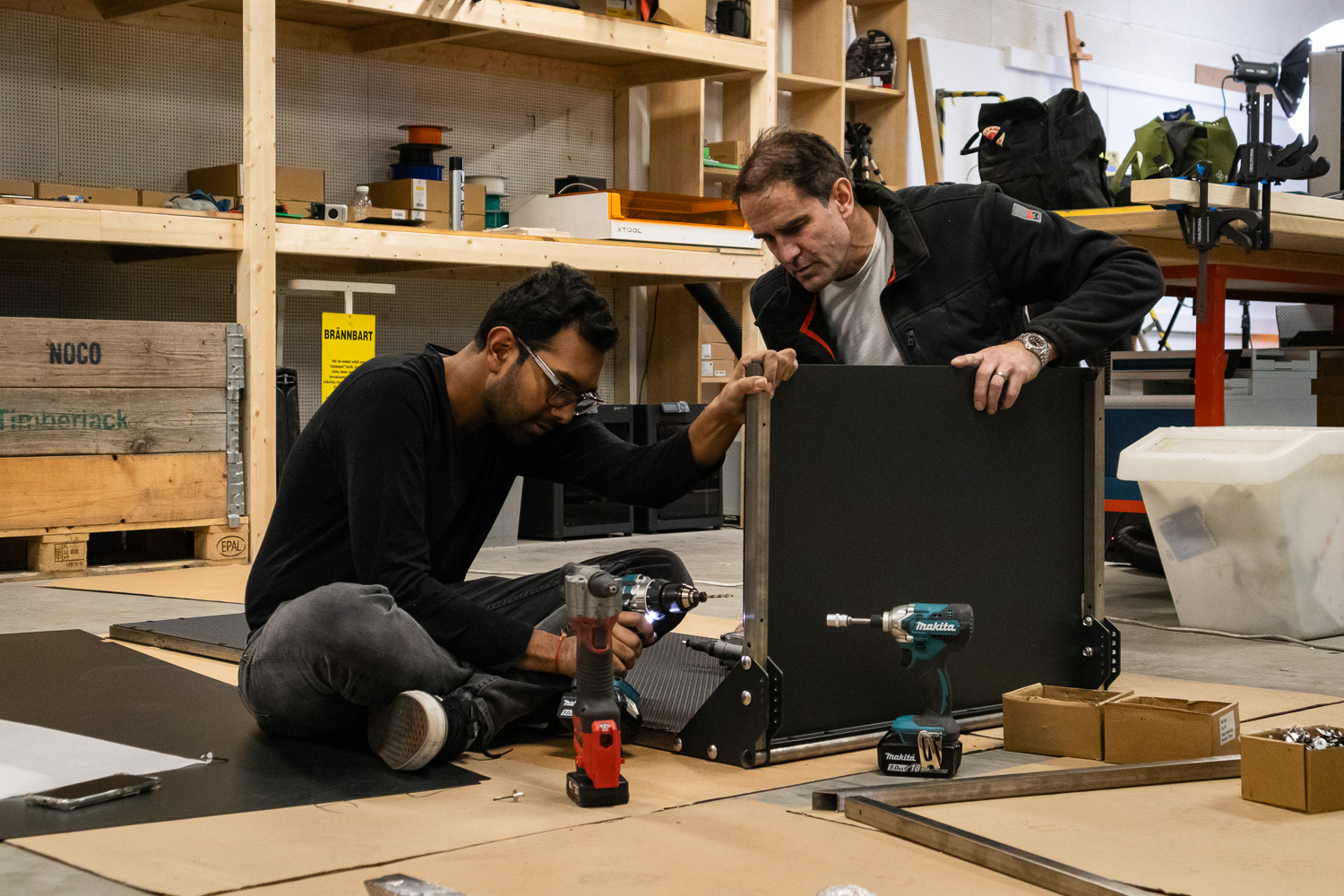 Assembling the box surrounded by tools and materials