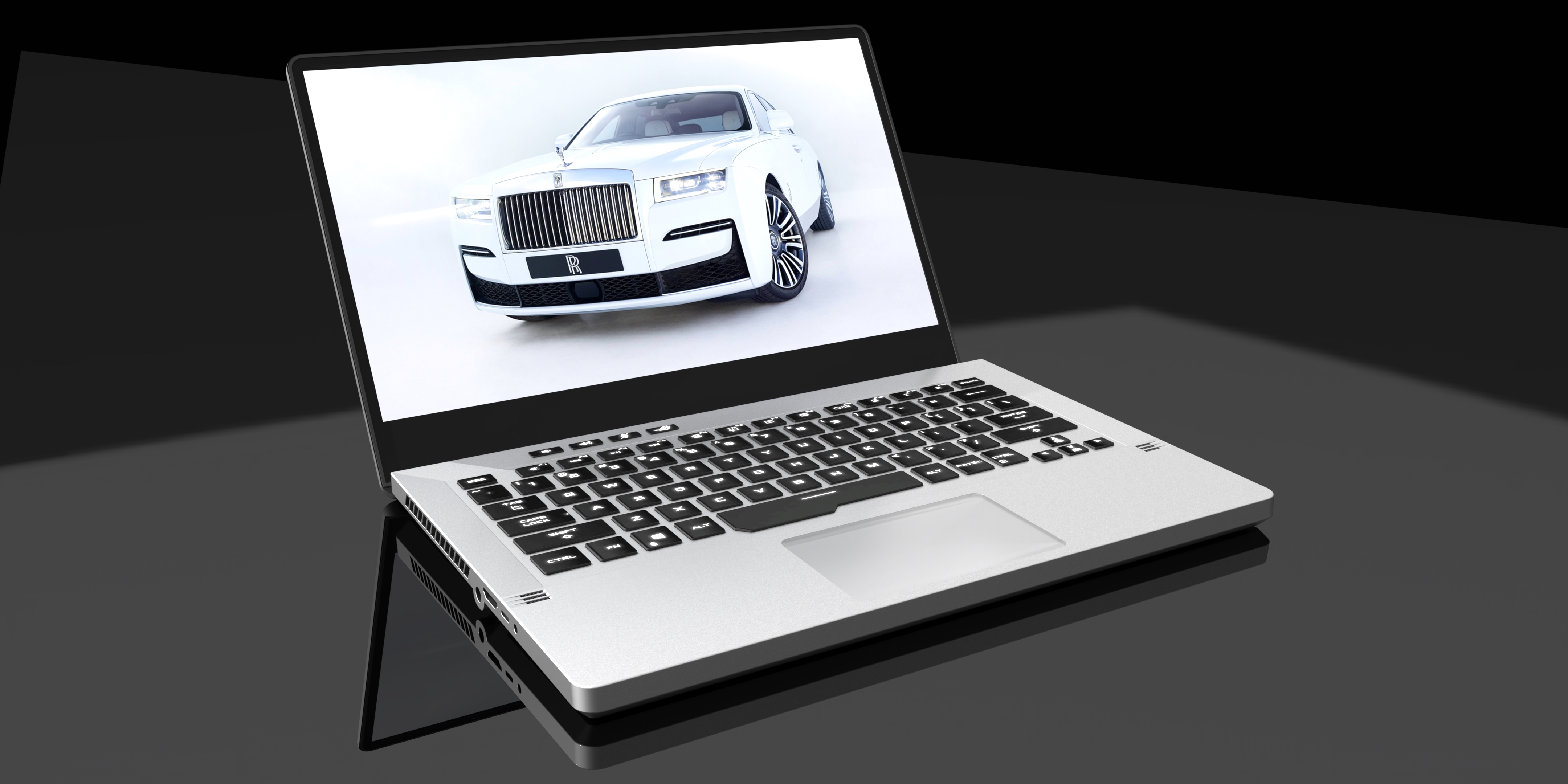Render of a slim laptop showing a white Rolls-Royce on screen